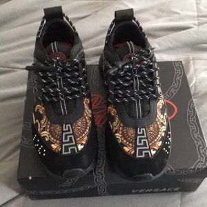 Versace chain reaction black and gold